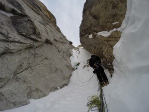 Ian Welsted digging through steep snow and looking for cracks on our first attempt of Pyramid, photo by Kris Irwin